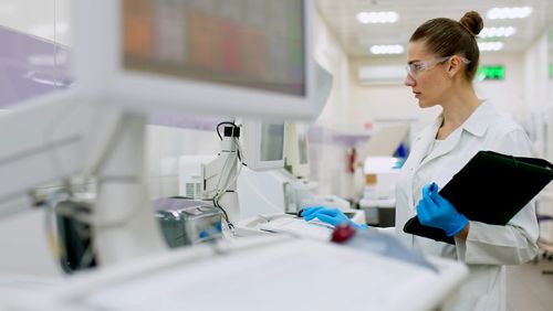 Woman doctor working in a dermatology lab